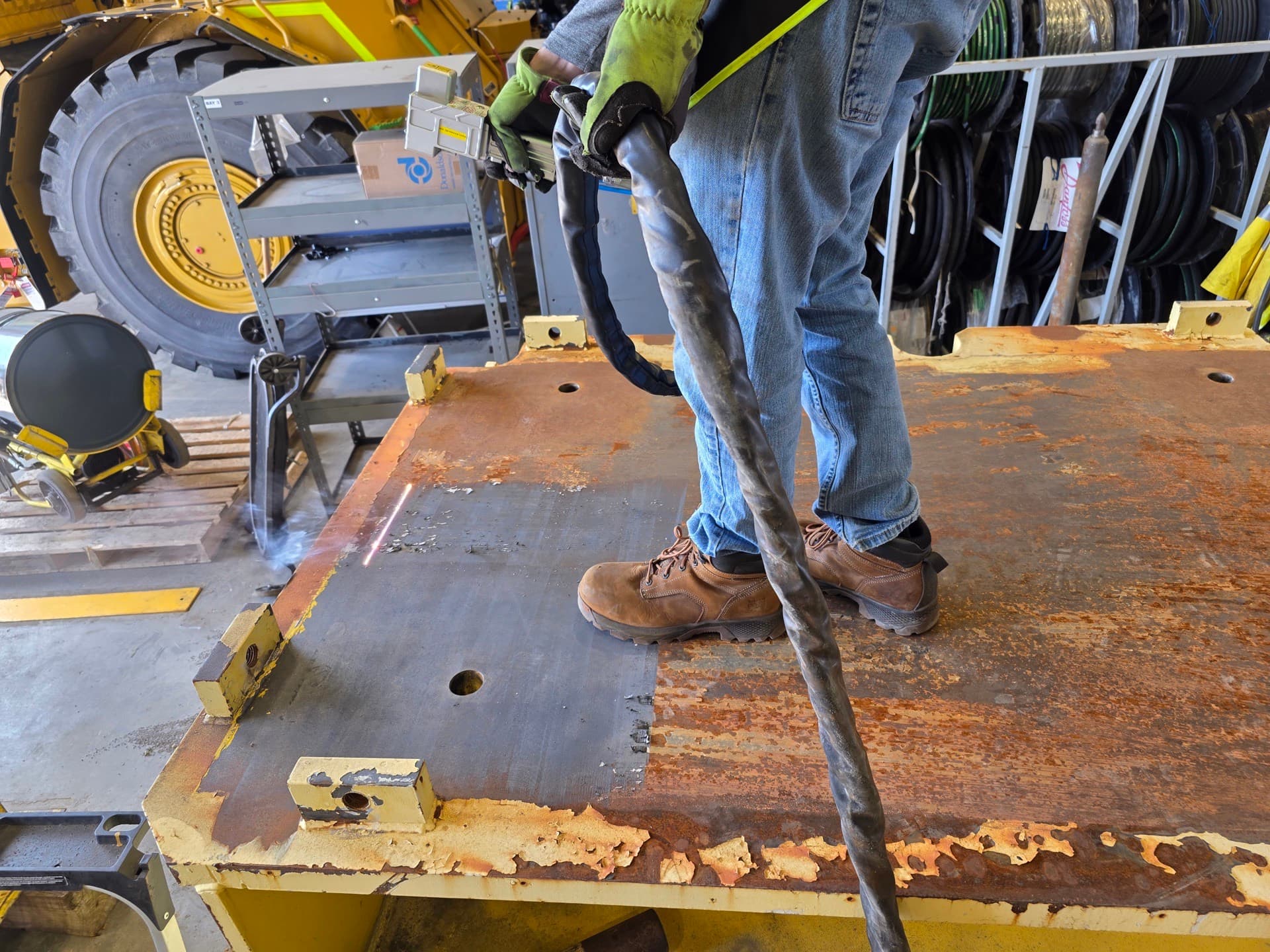 Laser cleaning system removing corrosion from structural surface